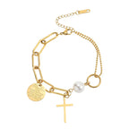 Gold-tone asymmetrical cross pearl chain bracelet with white pearl, heart disc, and cross