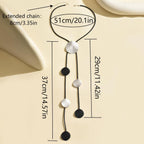 Disc tassel necklace with black cord, round pendants in silver and black colors
