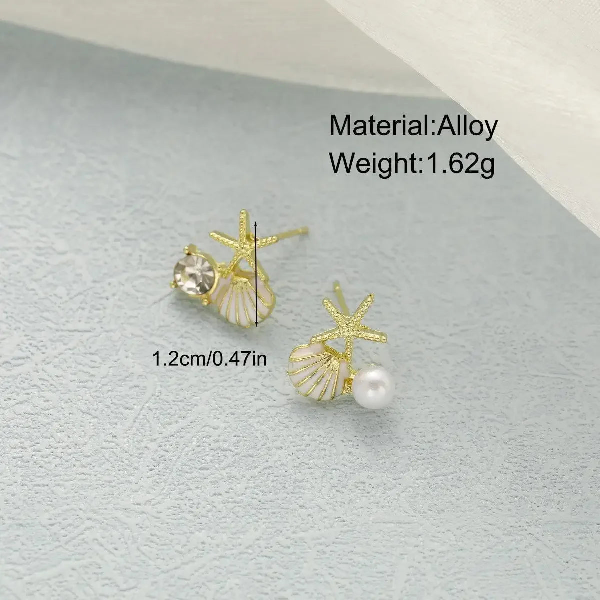Boucles d'oreilles pendantes bohème à pompons — Étoile de mer et coquillage