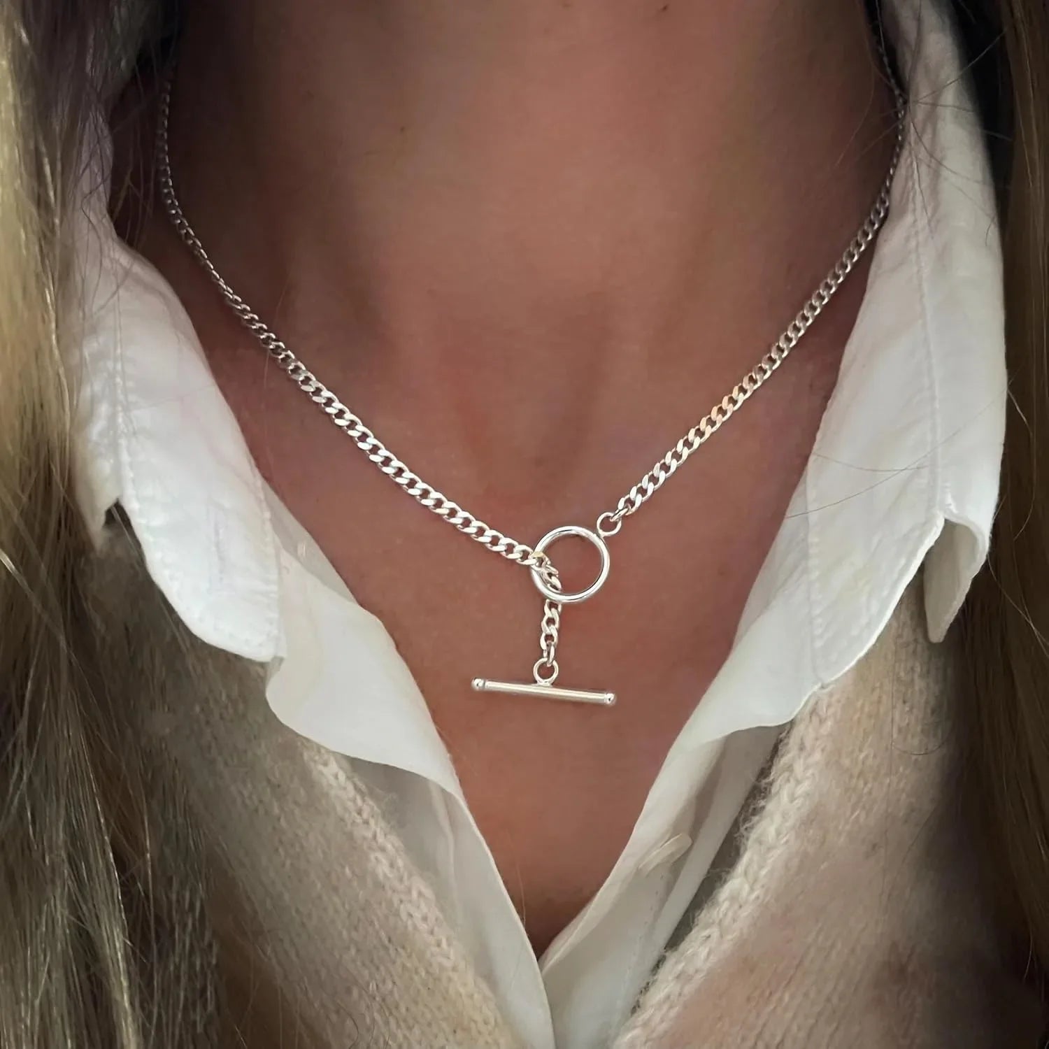 Layered silver-tone chain necklace with Cuban link and paperclip links, ring and bar charm