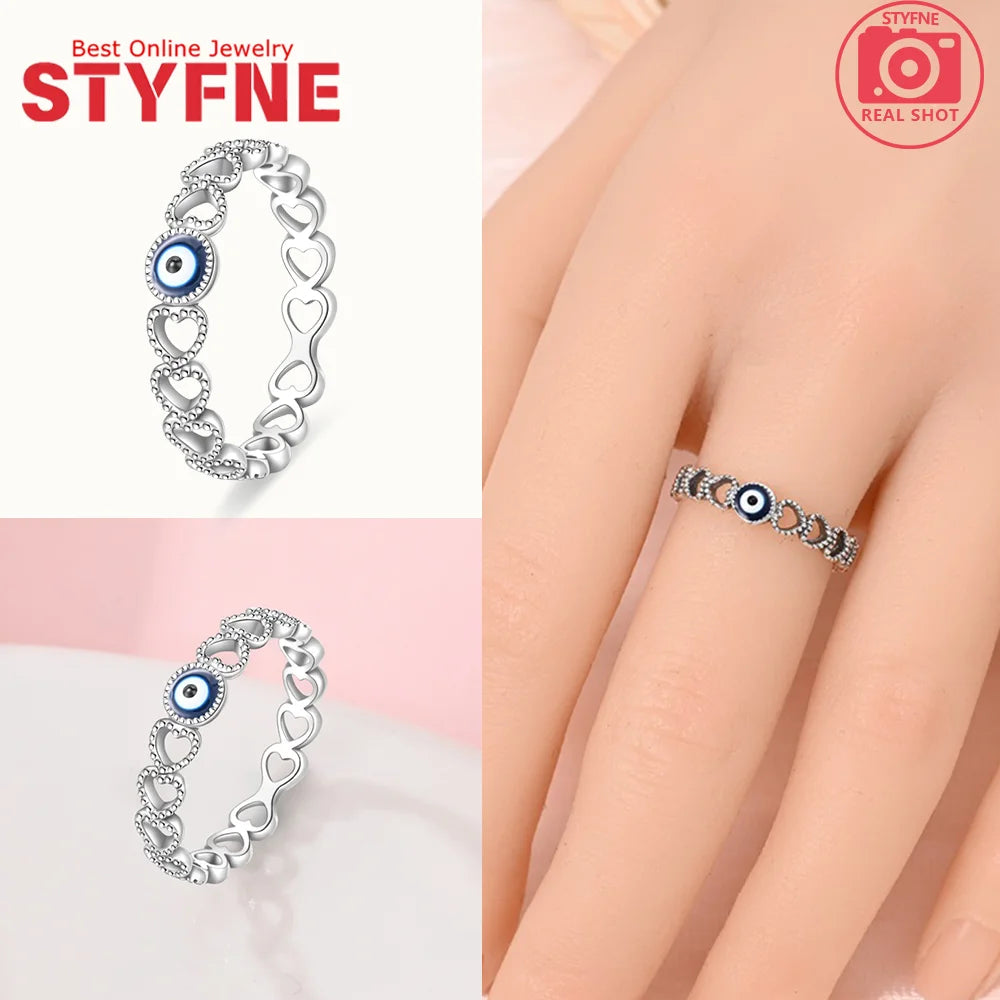 925 sterling silver evil eye band ring with blue eye and heart link design
