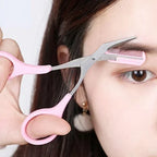Eyebrow scissors with comb, pink handle and metal blades with comb edge