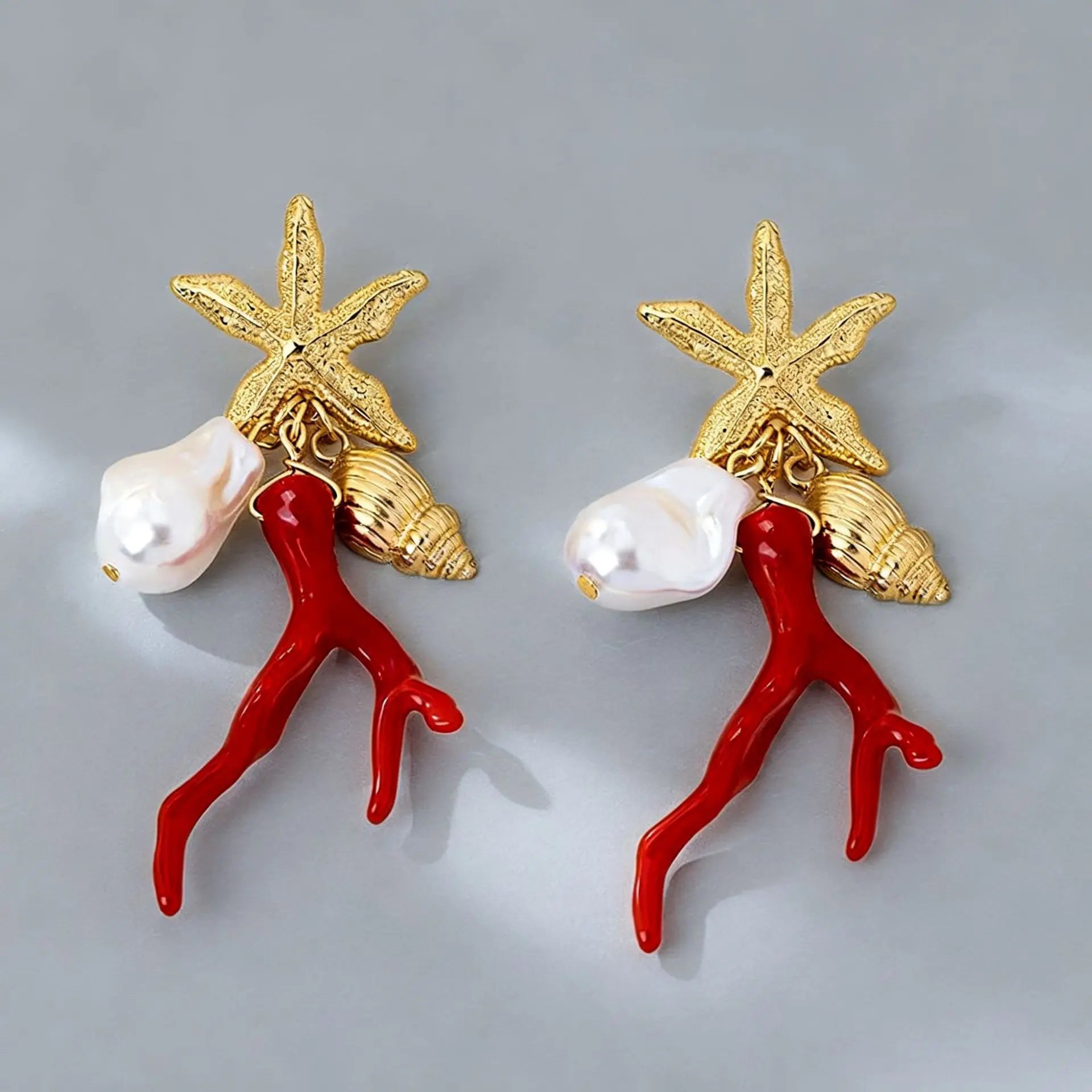 Star-and-figure resin earrings, red resin dancers and white pearls with gold-tone details