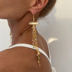 Boucles d'oreilles pendantes bohème à pompons — Étoile de mer et coquillage