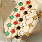 Multicolor clover jewelry set with gold-tone necklace, bracelet, and stud earrings