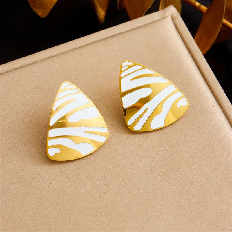 Tiger stripe teardrop earrings, white enamel with gold-tone edges and black stripes