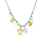 Sea turtle necklace with starfish charm, shell and pearl beads, blue teardrop pendant