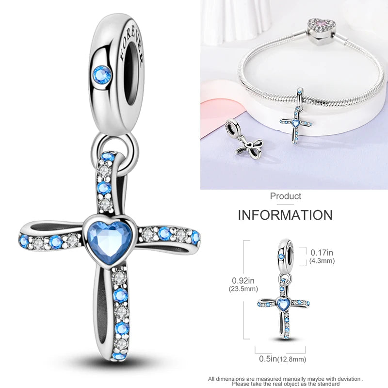 Sterling silver cross charm bead with blue heart center and crystal accents