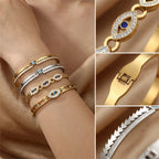 Close-up of gold-plated bangle with blue evil-eye oval and sparkling zircon detailing