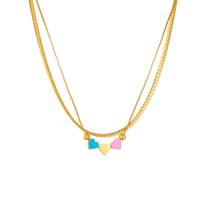 Gold double-chain necklace with blue, pink, and cream enamel heart charms