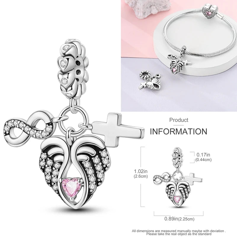 Sterling silver cross charm with pink heart and rhinestone details