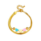 Gold heart charm bracelet with blue, pink, and cream enamel heart charms and clasp