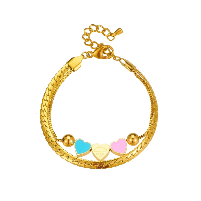 Gold heart charm bracelet with blue, pink, and cream enamel heart charms and clasp