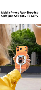 Orange magnetic selfie monitor screen held in hand with small live display