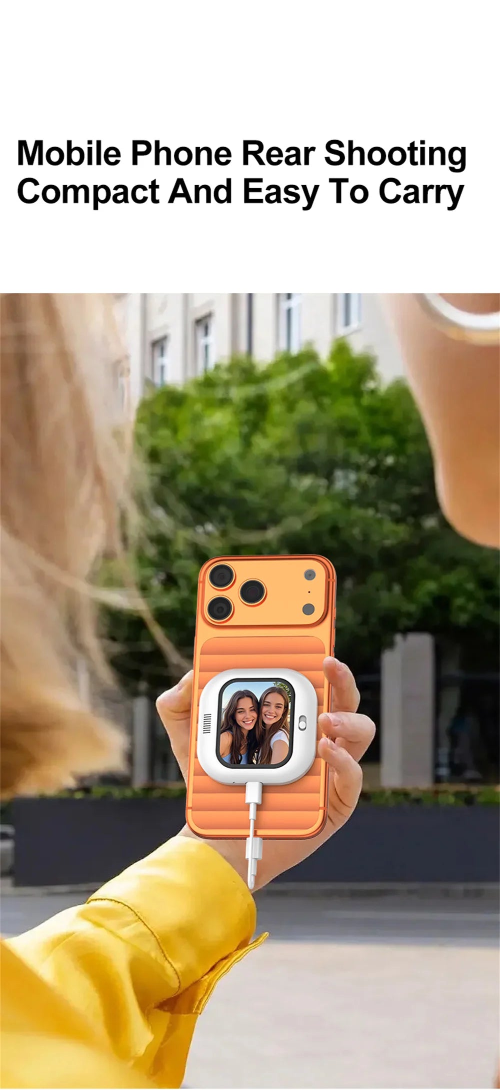 Orange magnetic selfie monitor screen held in hand with small live display