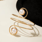 Gold-tone upper arm bracelet with spiral wire and round pearl stone accent