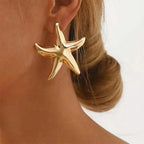 Boucles d'oreilles pendantes bohème à pompons — Étoile de mer et coquillage