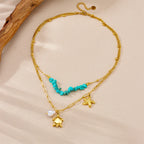 Gold chain double-layer necklace with turquoise beads, starfish and turtle charms, pearl drop