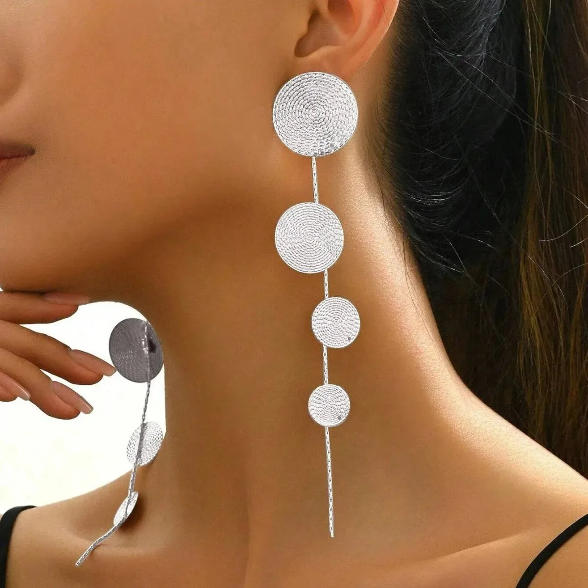 Silver-tone woven disc dangle earrings with four hanging circles and long tassel drops