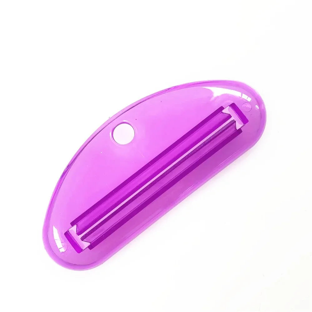 Purple toothpaste tube squeezer dispenser with long slotted opening and small side hole