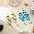 Dangling koi charm earrings set with gold and turquoise bead tassels and fish-eye tops.