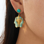 Gold-tone turquoise round stud earrings with dangling pharaoh face enamel charms