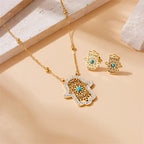 Gold-tone hamsa hand necklace pendant with turquoise stone and matching stud earrings