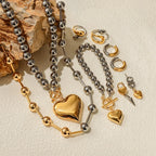 Heart charm jewelry set with beaded necklaces, heart pendants, rings, and hoop earrings