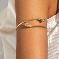 Gold-tone open cuff bracelet with smooth curved double band