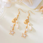 Boucles d'oreilles pendantes bohème à pompons — Étoile de mer et coquillage