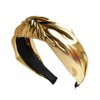 Wide PU leather headband in gold with twisted knot top and elastic ends