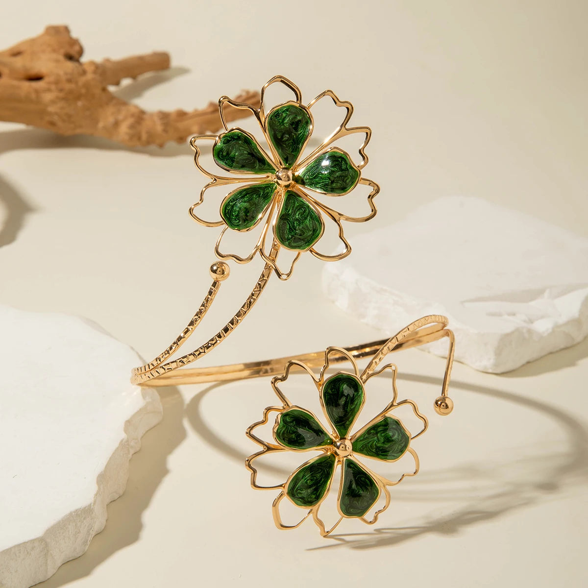 Gold flower upper arm bracelet with dark green stone petals and thin chain band