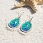 Pair of teardrop seahorse shell earrings in green and blue enamel with silver-tone border