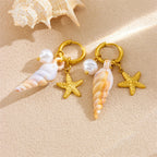 Gold hoop earrings with starfish charms and white pearl conch drops