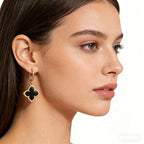 Four-leaf clover dangle earring with black enamel clover and gold-tone hoop hook