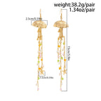Boucles d'oreilles pendantes bohème à pompons — Étoile de mer et coquillage