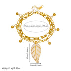 Gold double-layer chain bracelet with leaf pendant and round bead drops