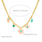 Gold-tone evil eye charm necklace with heart, hamsa, and turquoise bead accents