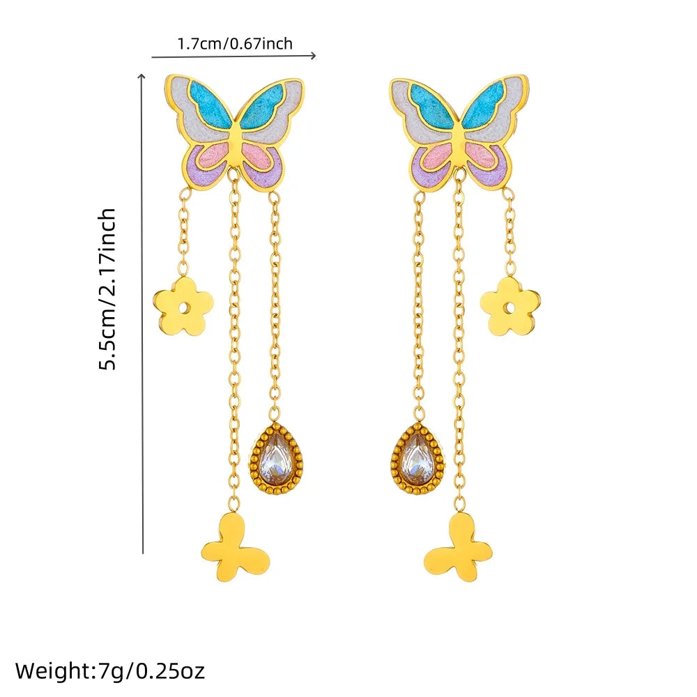 Butterfly drop tassel earrings with blue enamel wings and gold flower plus teardrop charms