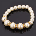 Pearl bracelet with large center pearl and gold-tone crystal bead accents