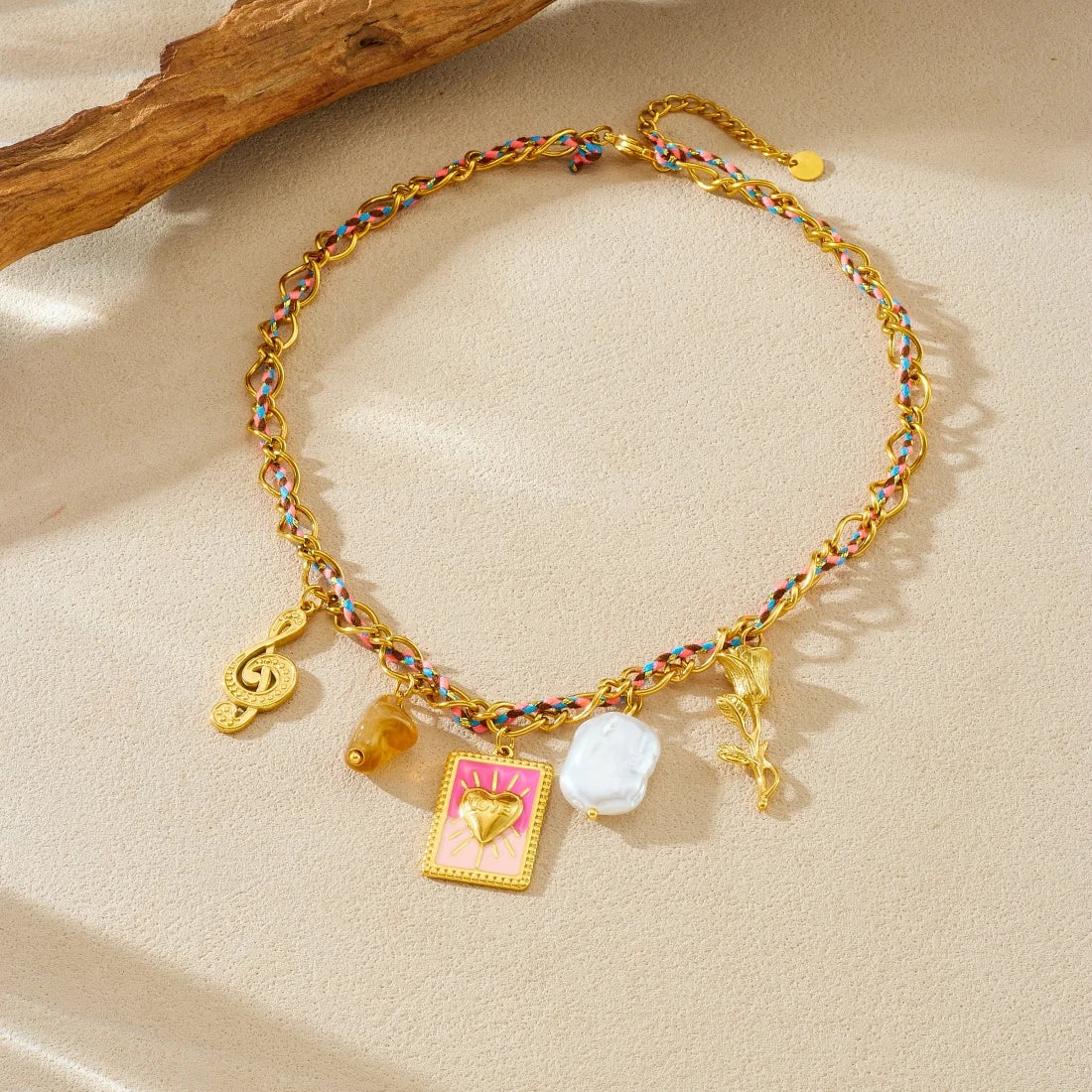 Charm necklace with rainbow chain, gold heart charm, pink heart pendant, white pearl, amber bead