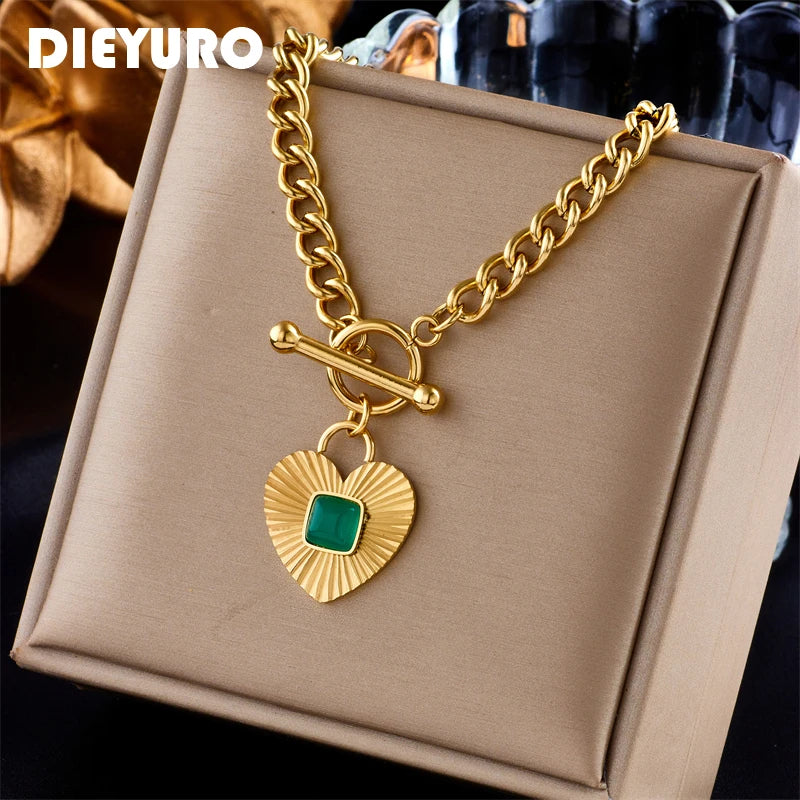 Gold-tone heart pendant necklace with green square stone heart charm and curb chain