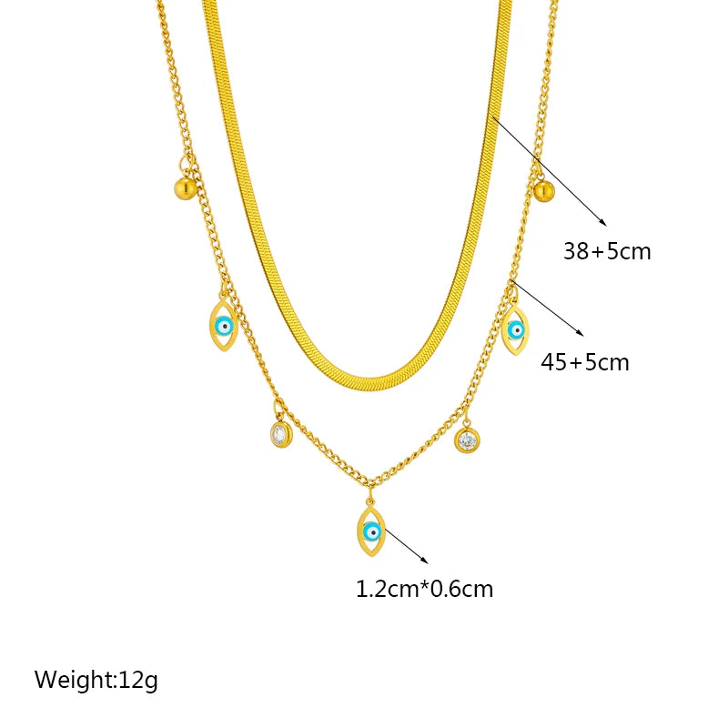 Gold-tone double-layer snake chain necklace with blue evil-eye charms; length 38+5cm & 45+5cm