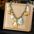 Sea turtle and starfish pendant necklace with mixed pearls and shells, blue beads