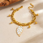 Gold double-layer chain bracelet with large leaf charm and bead tassels