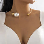 Gold-tone collar necklace with round white pearl and small gold bead details