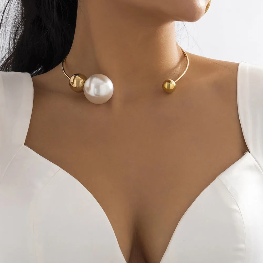 Gold-tone collar necklace with round white pearl and small gold bead details