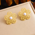 Gold-tone filigree flower earrings with white pearl centers