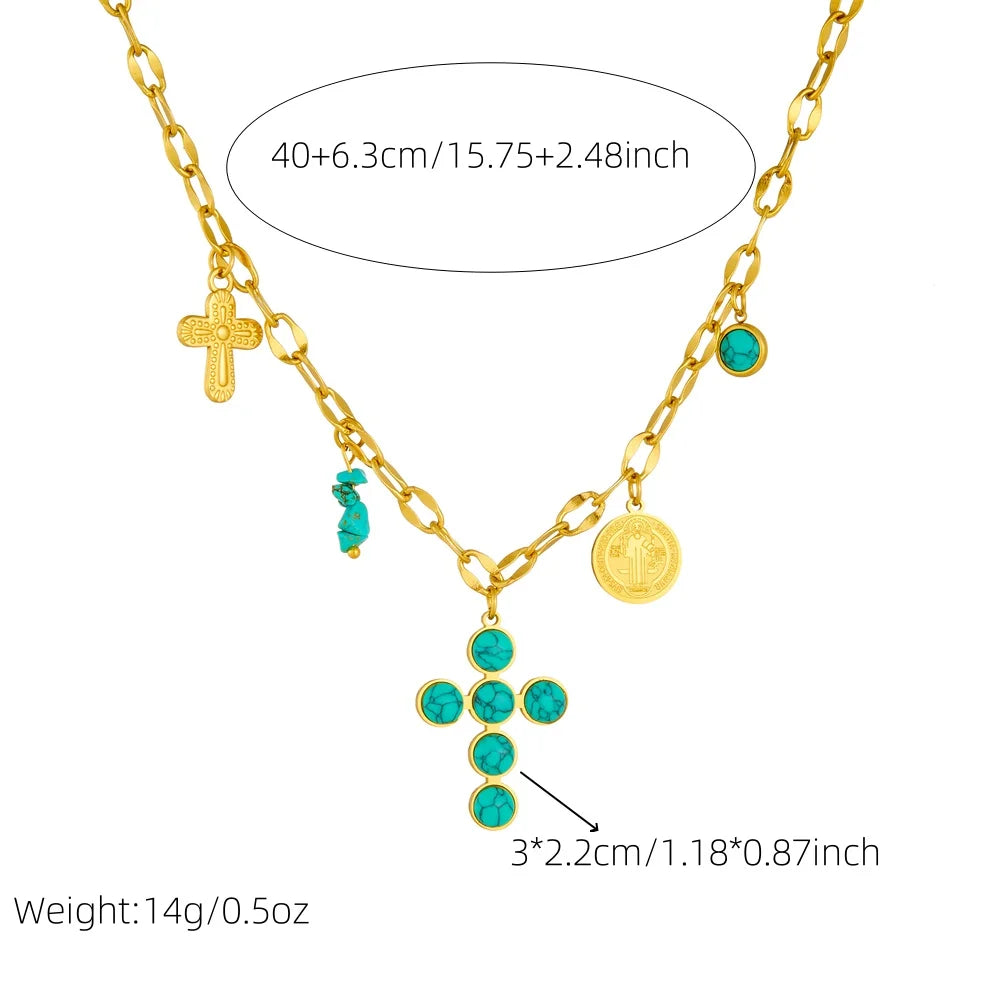 Gold-tone cross pendant necklace with turquoise cabochon beads and round charm