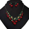 Cherry fruit necklace and earrings set: red cherry beads with green leaves, silver-tone settings
